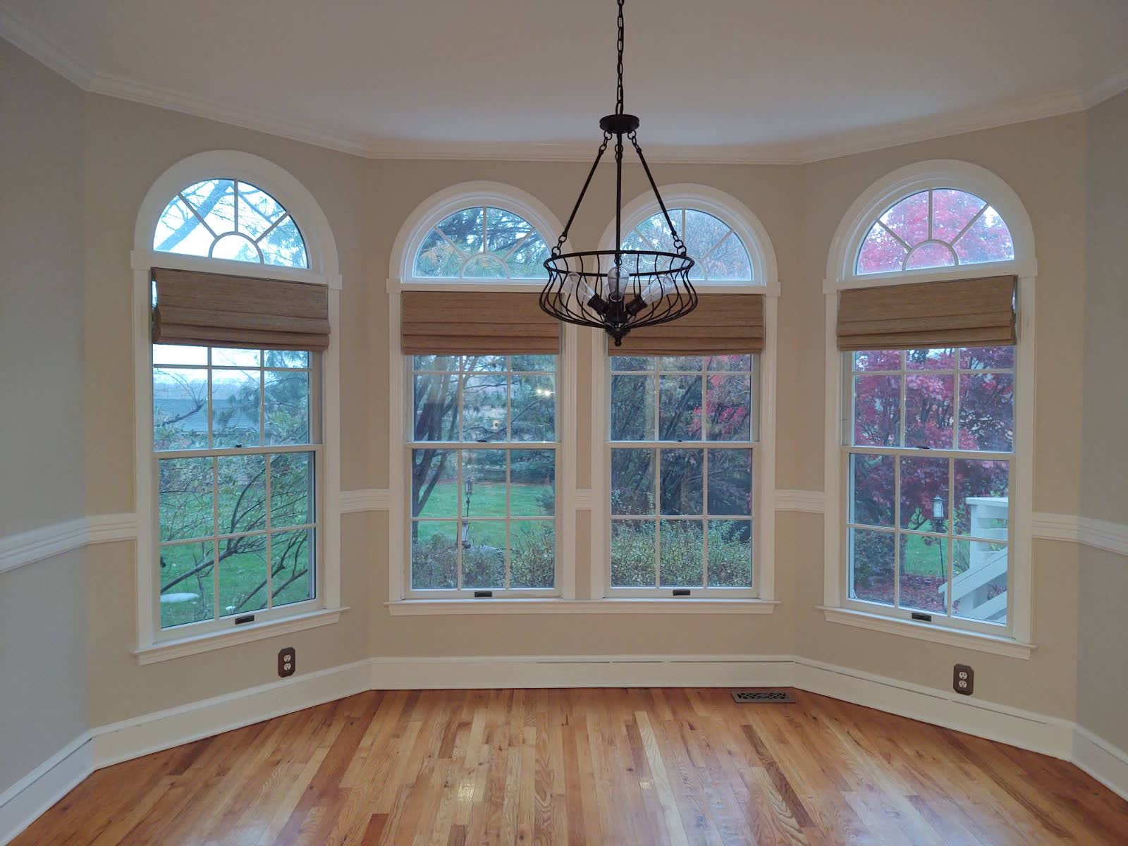 Refinished red oak floor in a dining nook, one of our sanding and refinishing projects